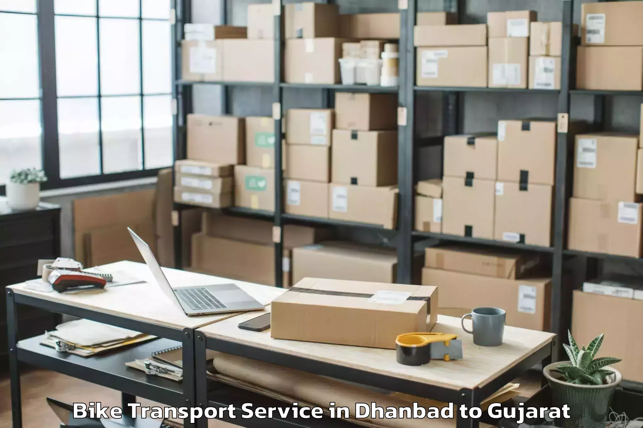 Book Dhanbad to Gussar Bike Transport